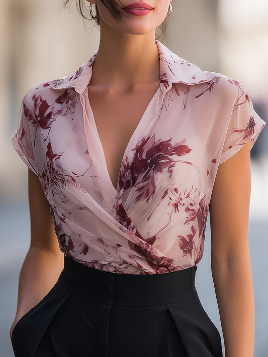 Blusa corta con colletto drappeggiato a stampa floreale